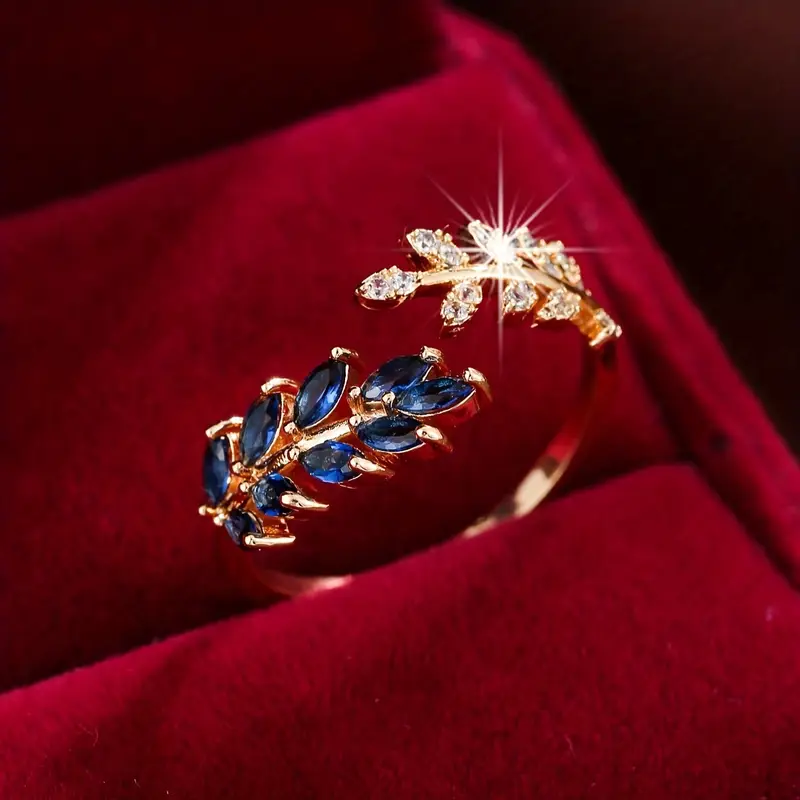 Goldring mit offenem blauen Zirkon